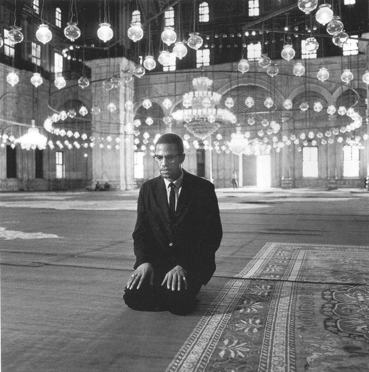 Malcolm X praying in the Mohammed Ali Mosque, Cairo, Egypt, September 1964